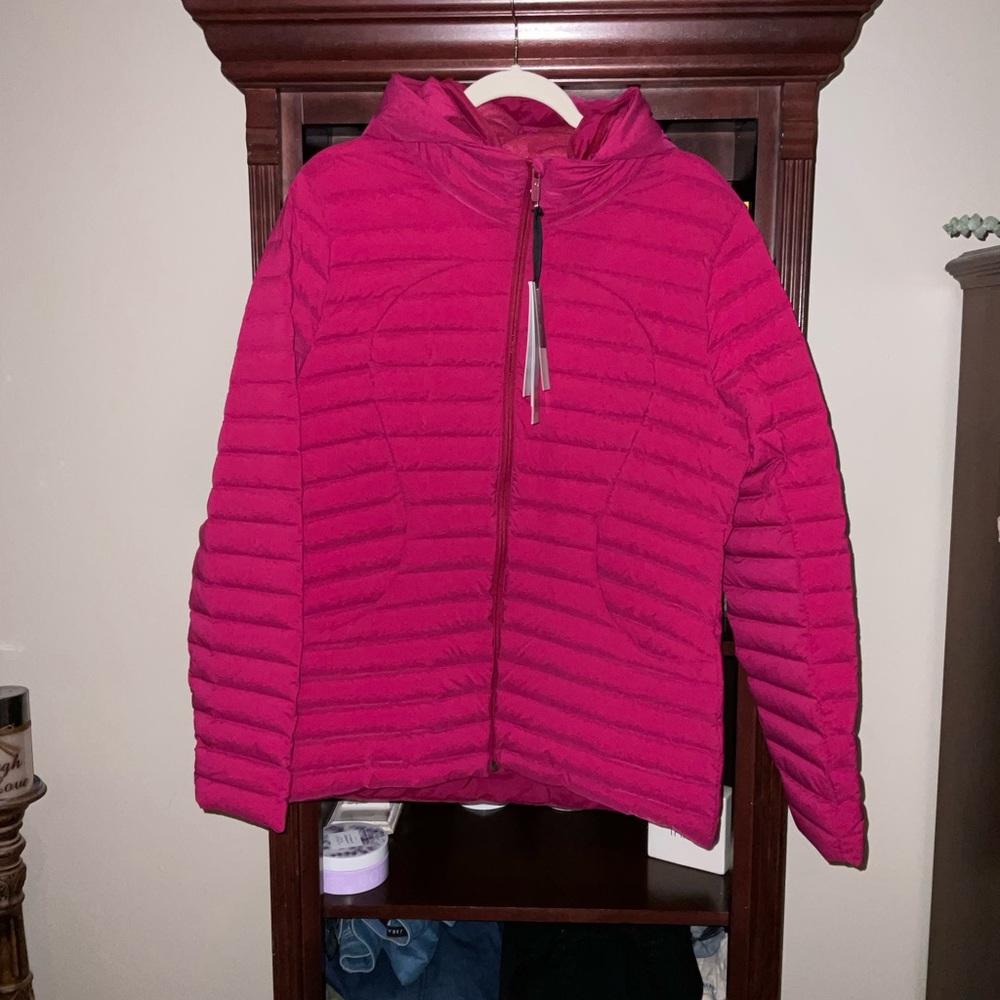 Brand new Lululemon spring jacket size 12 with bag